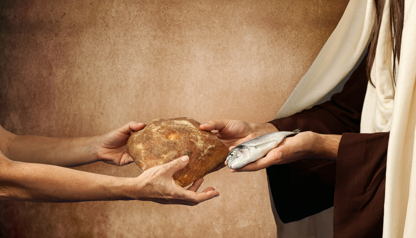 gods interfaith food table hero showing helping hands distributing bread and fish to feed the hungry